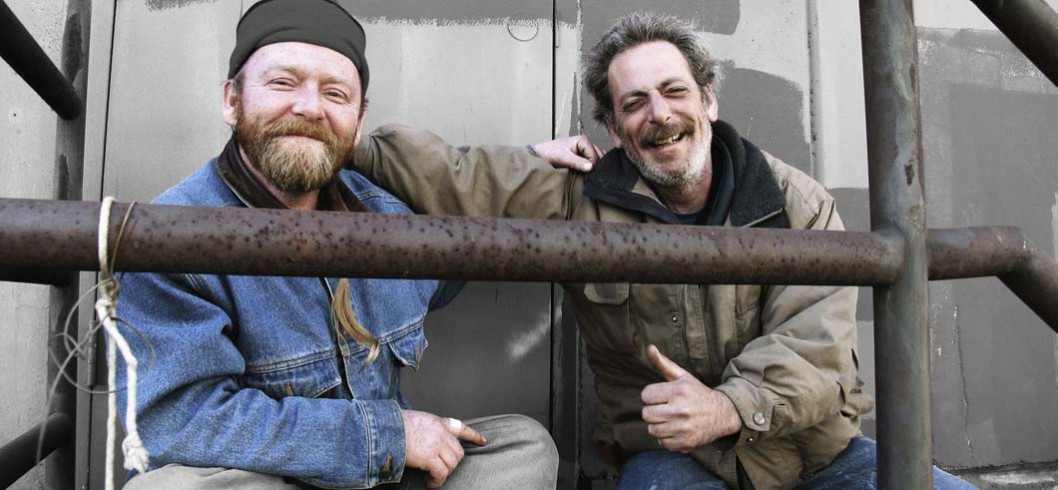 Two homeless people talking